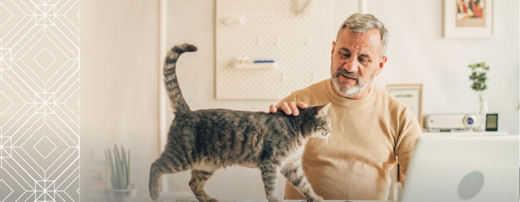 We welcome all your furry friends a man petting a cat
