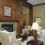 a lounge room with seating and a fireplace