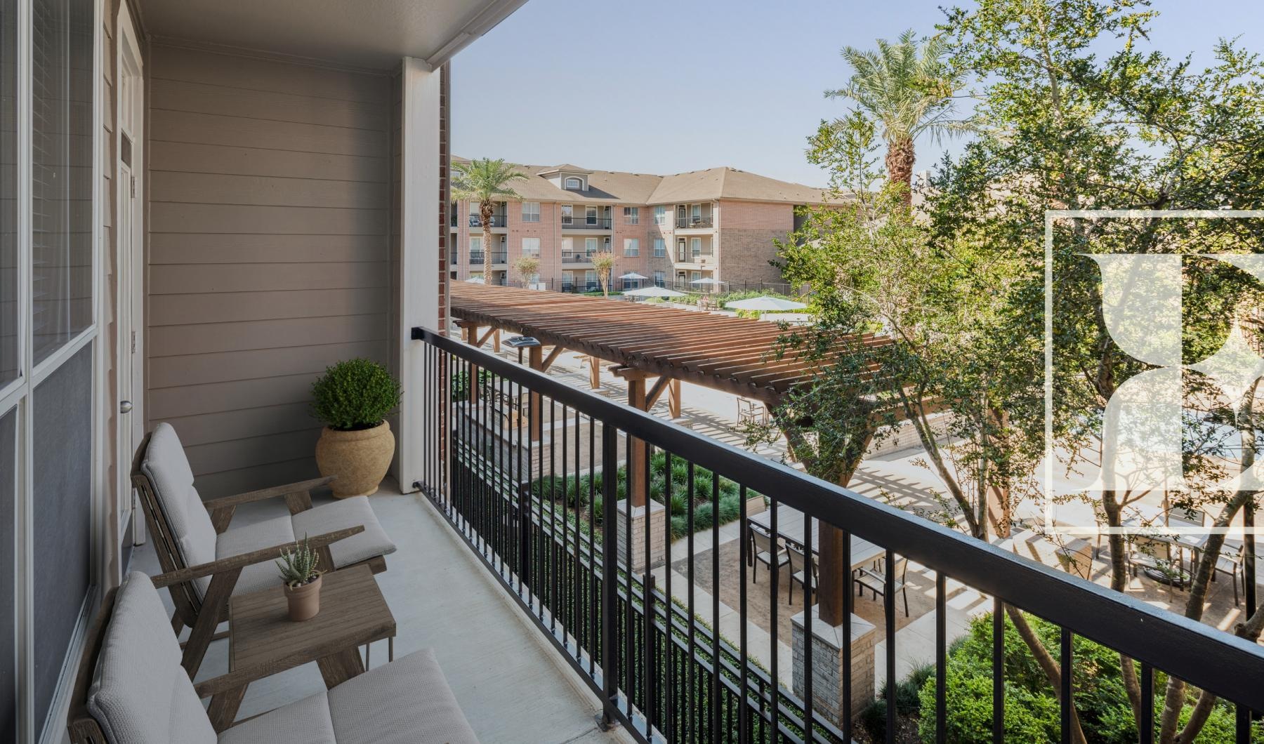 Generous balconies a balcony with a tree and a building in the background