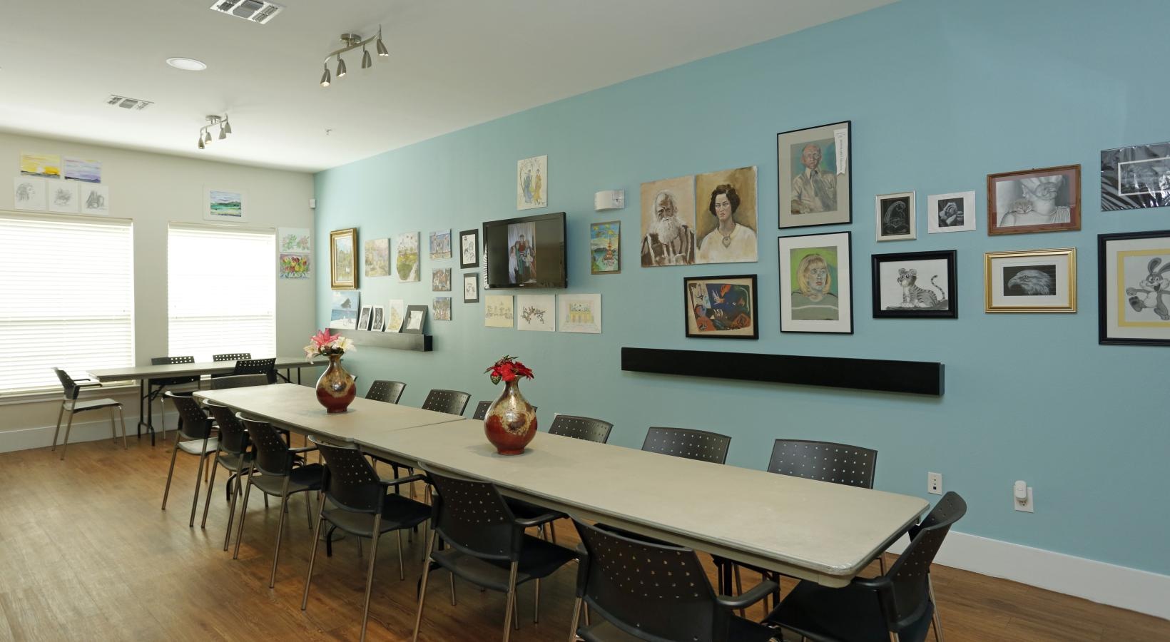 Access to resident-only features a room with a long table and chairs