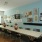 a room with a long table and chairs