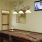 a room with a television and a pool table