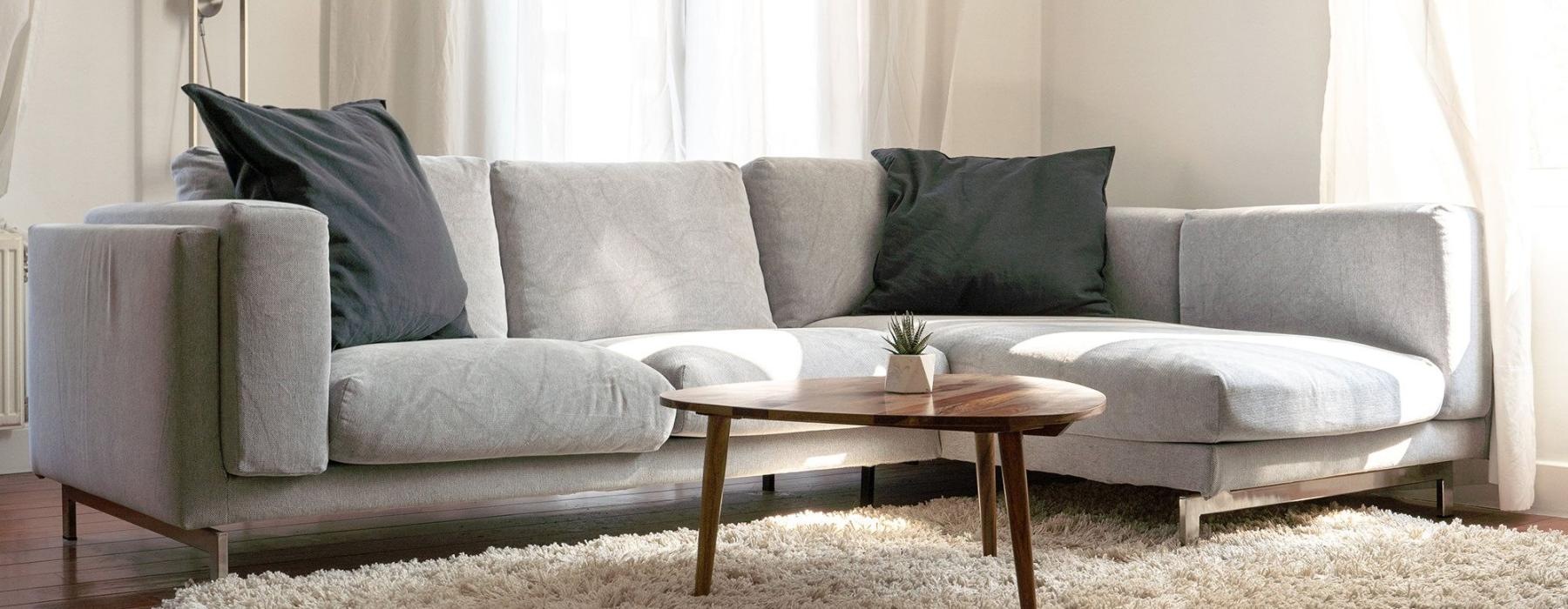 oversized windows brighten spacious, furnished living room