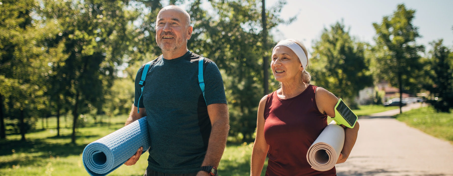 A new standard of living man and woman holding yoga mats