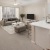 a living room with a couch and a dining table