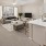 a living room with a couch and a dining table